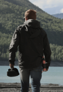 Person outdoors holding bear spray